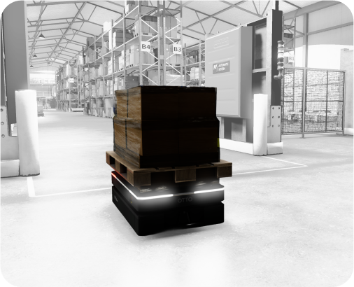 Autonomous mobile robot transporting a wooden pallet with boxes inside a warehouse environment.